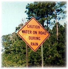 Caution: Water on road during rain