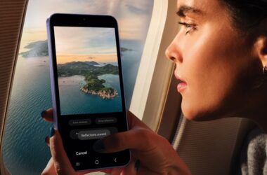 Woman erasing reflections on live Samsung Camera shot from airplane window