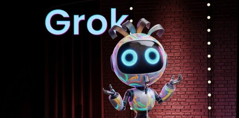 Robot standing in front of Grok sign