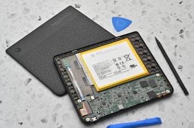 Disassembled Kobo e-reader beside iFixit tools