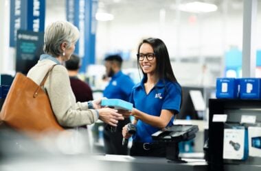 Senior woman buying product from Best Buy