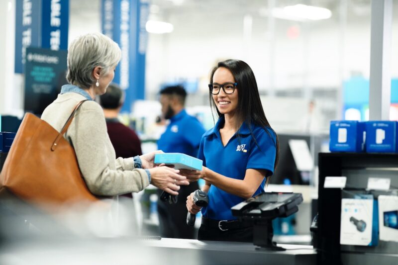 Senior woman buying product from Best Buy