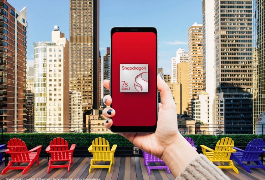 Hand holding up Qualcomm Snapdragon 7s Gen 3 powered phone