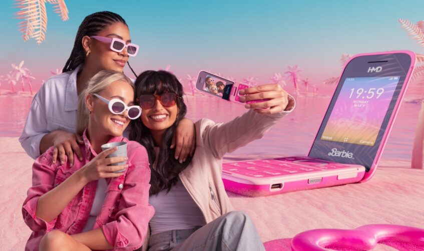 Three women taking selfie with Barbie Phone