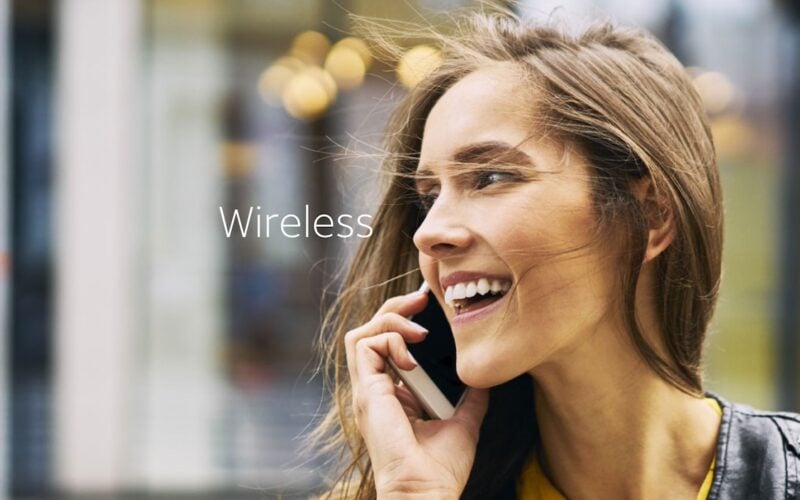 Smiling woman making phone call