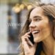 Smiling woman making phone call