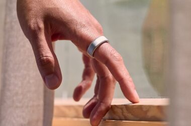 Close-up shot of hand wearing smart ring on finger