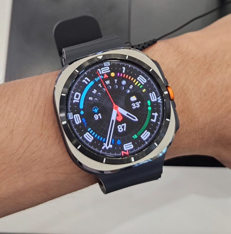 Hand wearing Galaxy Watch Ultra running One UI 6