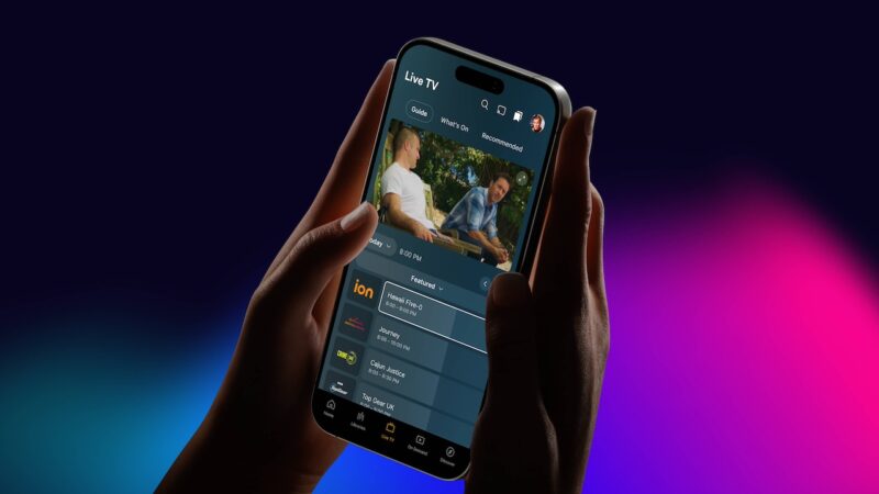 Hand holding phone displaying new Plex app interface