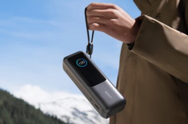 Person dangling Anker 165W power bank by the retractable cable
