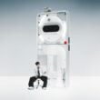 Asian man sitting on stool beside giant white Nothing Phone 3a