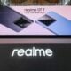 Glowing Realme sign with GT 7 phone series launch banner behind it