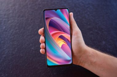 Hand holding phone with colorful display
