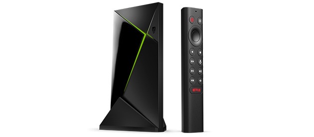 Black and green Nvidia Shield TV Pro with remote control