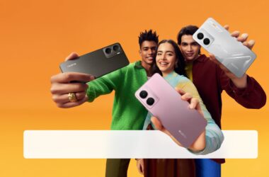 Two men and one woman smiling and holding out Realme P3 phones