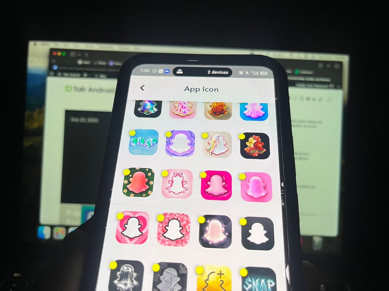 Phone showing different colourful Snapchat app icons 