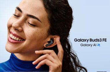 Smiling woman tapping earbuds tucked into her ear with Galaxy Buds 3 FE text beside her