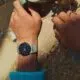 Hand wearing Pixel Watch 4 holding coffee mug