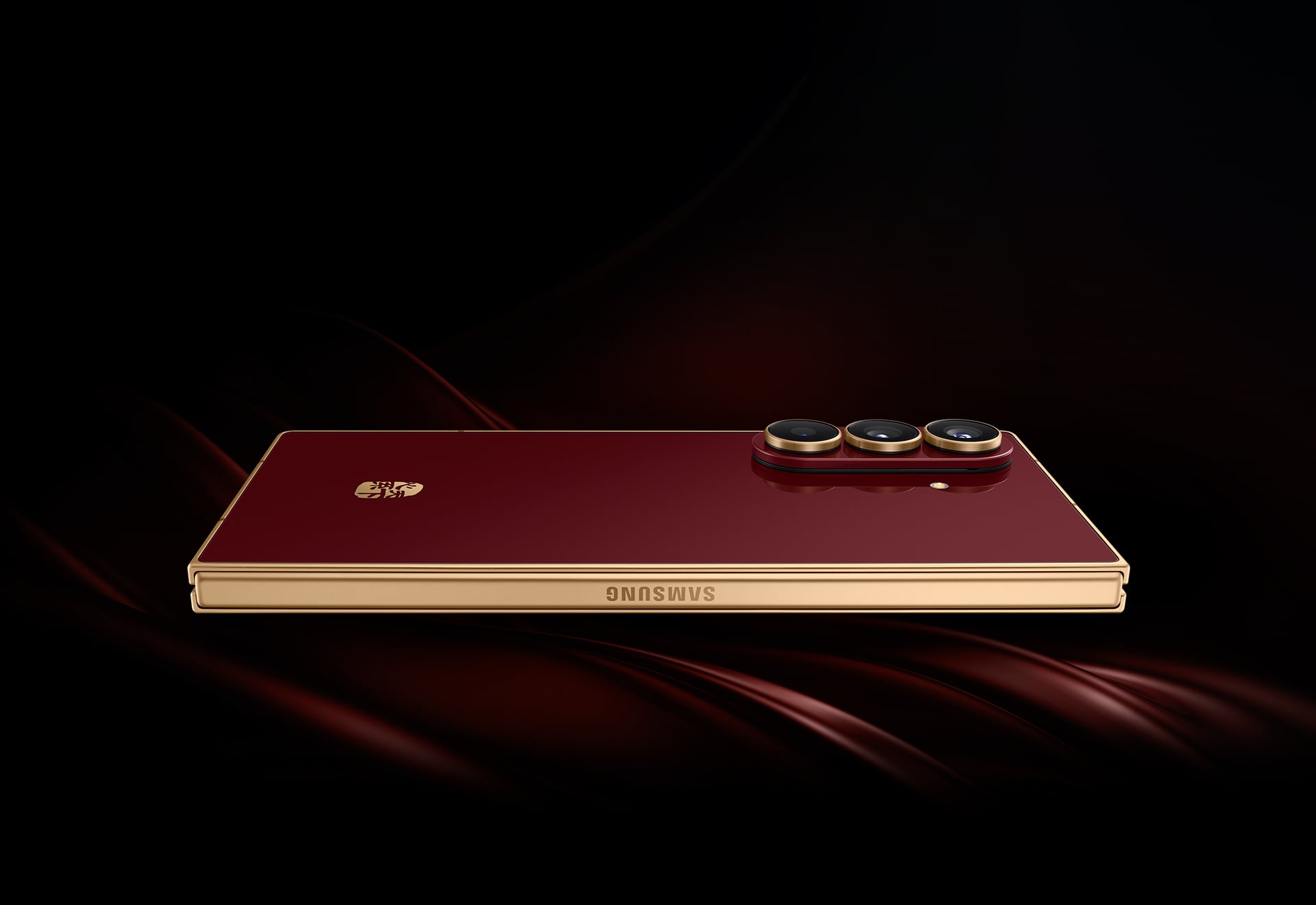 Folded Galaxy W26 phone in red and gold color