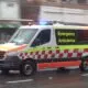 Australian ambulance moving fast on the road