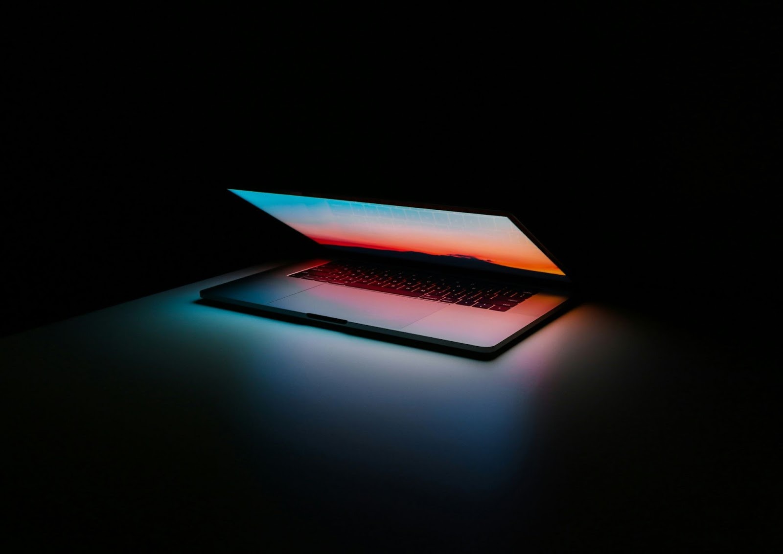 A laptop with a colorful wallpaper.