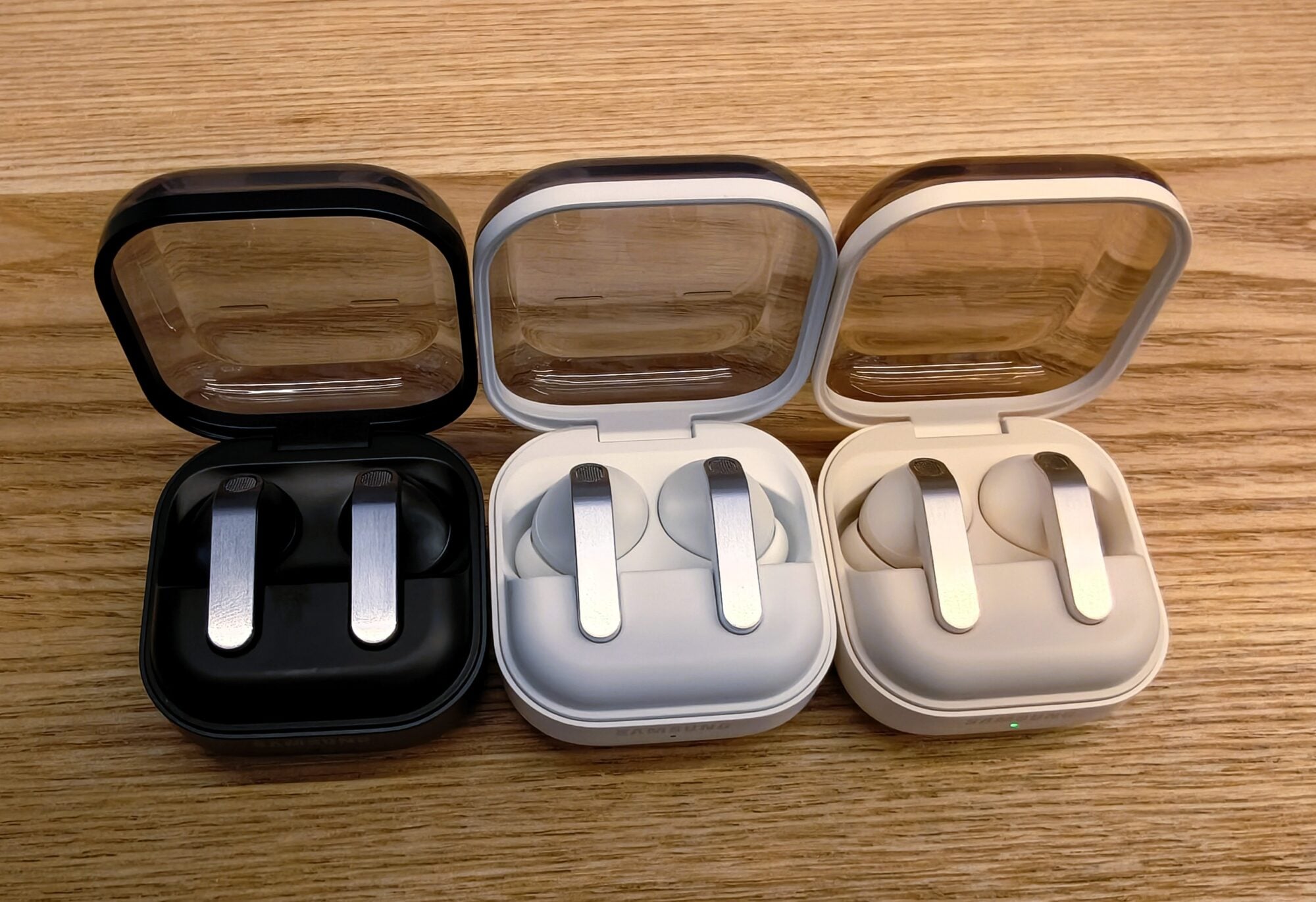 Samsung Galaxy Buds4 Pro charging cases in black, silver and cream