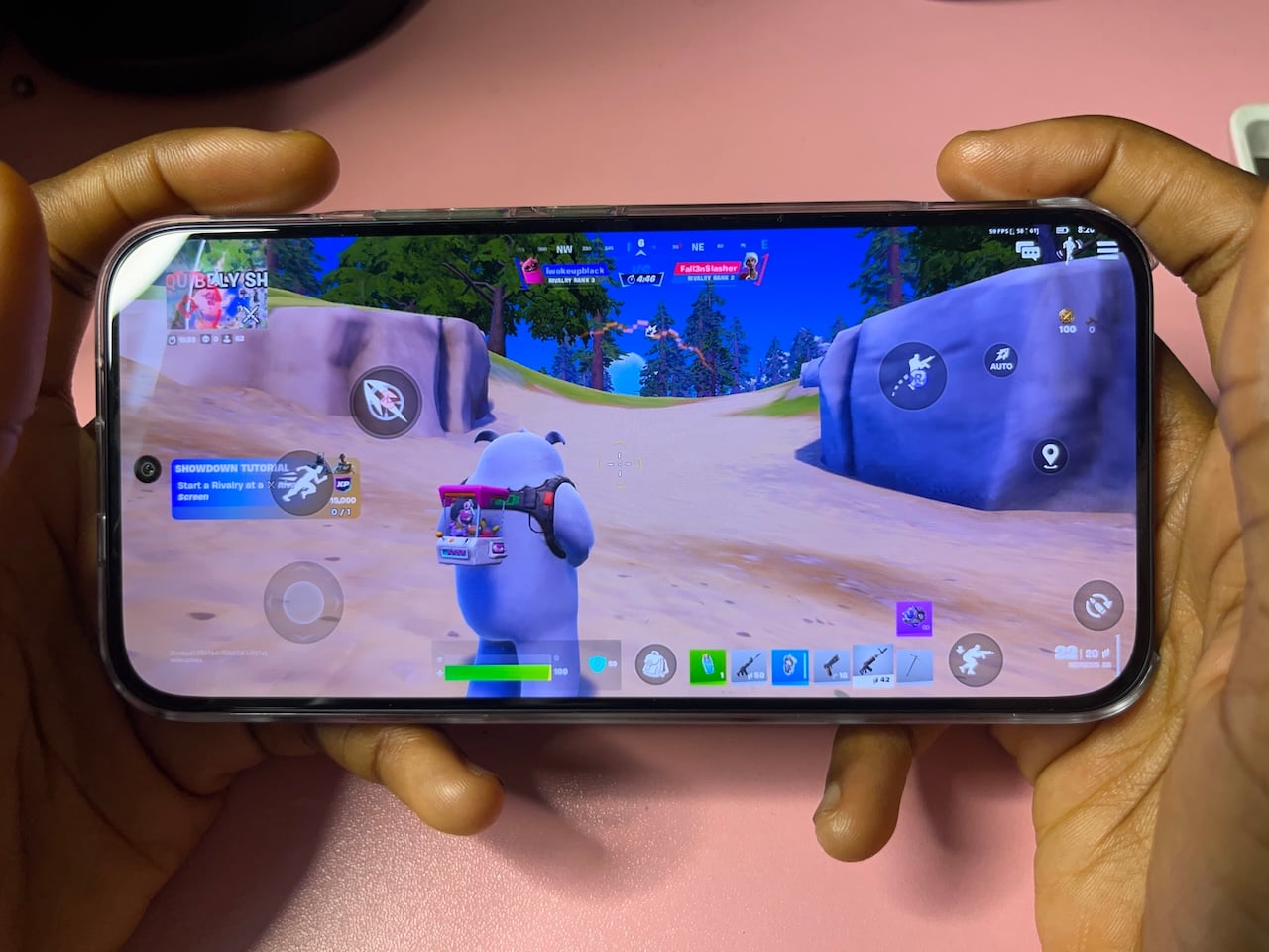 Person playing Fortnite game on Infinix GT 50 Pro