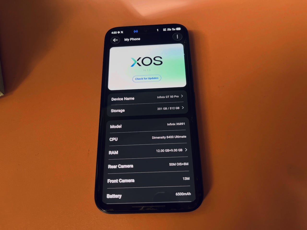 Infinix GT 50 Pro phone showing its own specifications on the screen