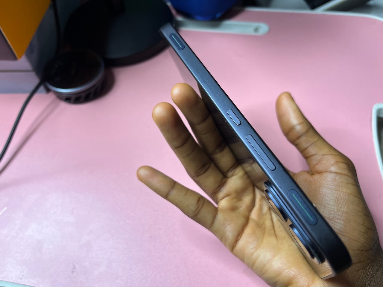 Side view of Infinix GT 50 Pro showing gaming triggers and volume rocker