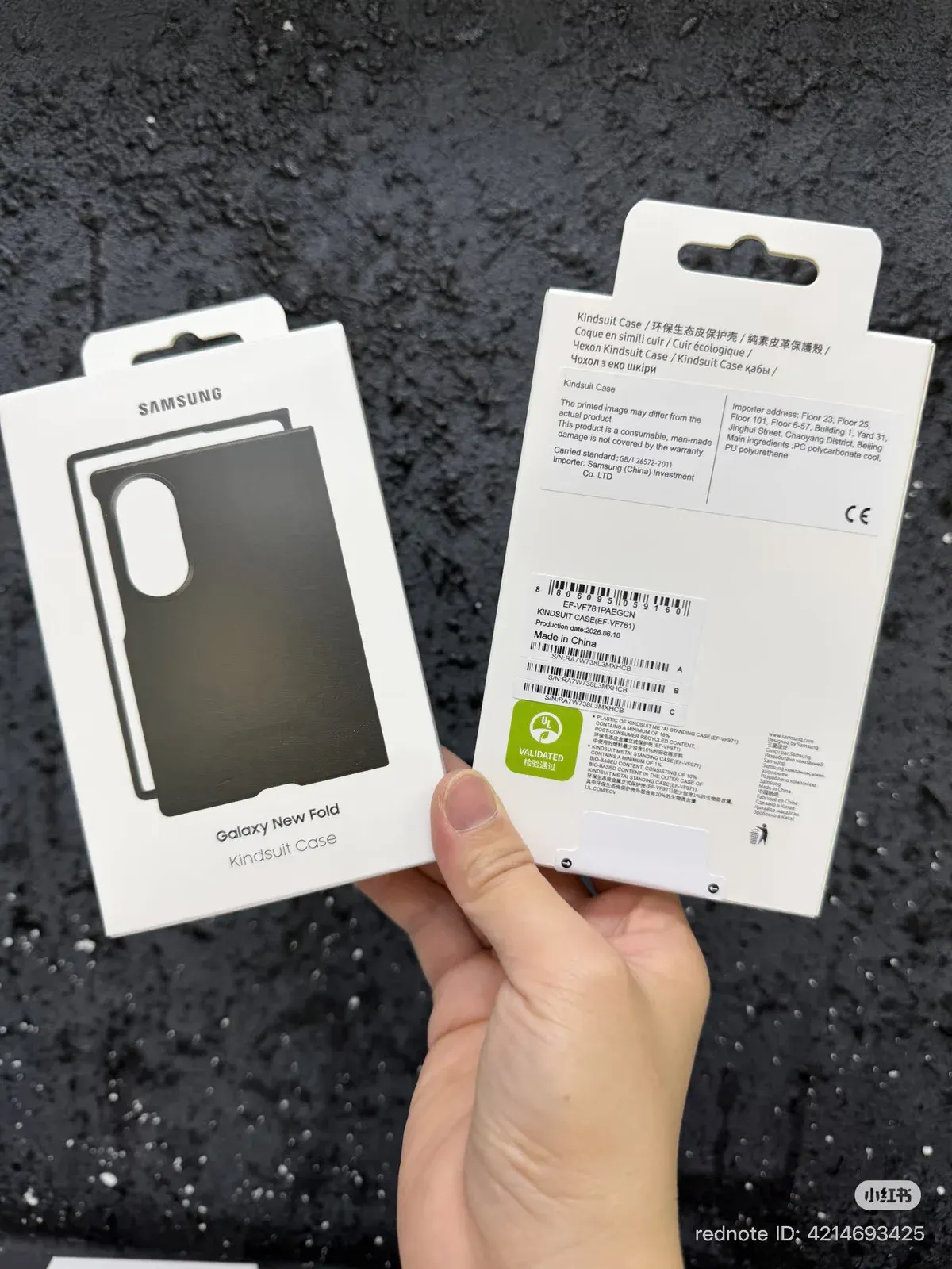 Hand holding two Kindsuit case packets