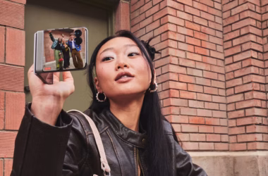 Woman holding foldable Motorola Razr 2026