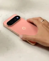 Hand wearing ring resting on Google Pixel 11 Pro back