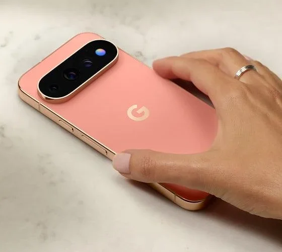 Hand wearing ring resting on Google Pixel 11 Pro back