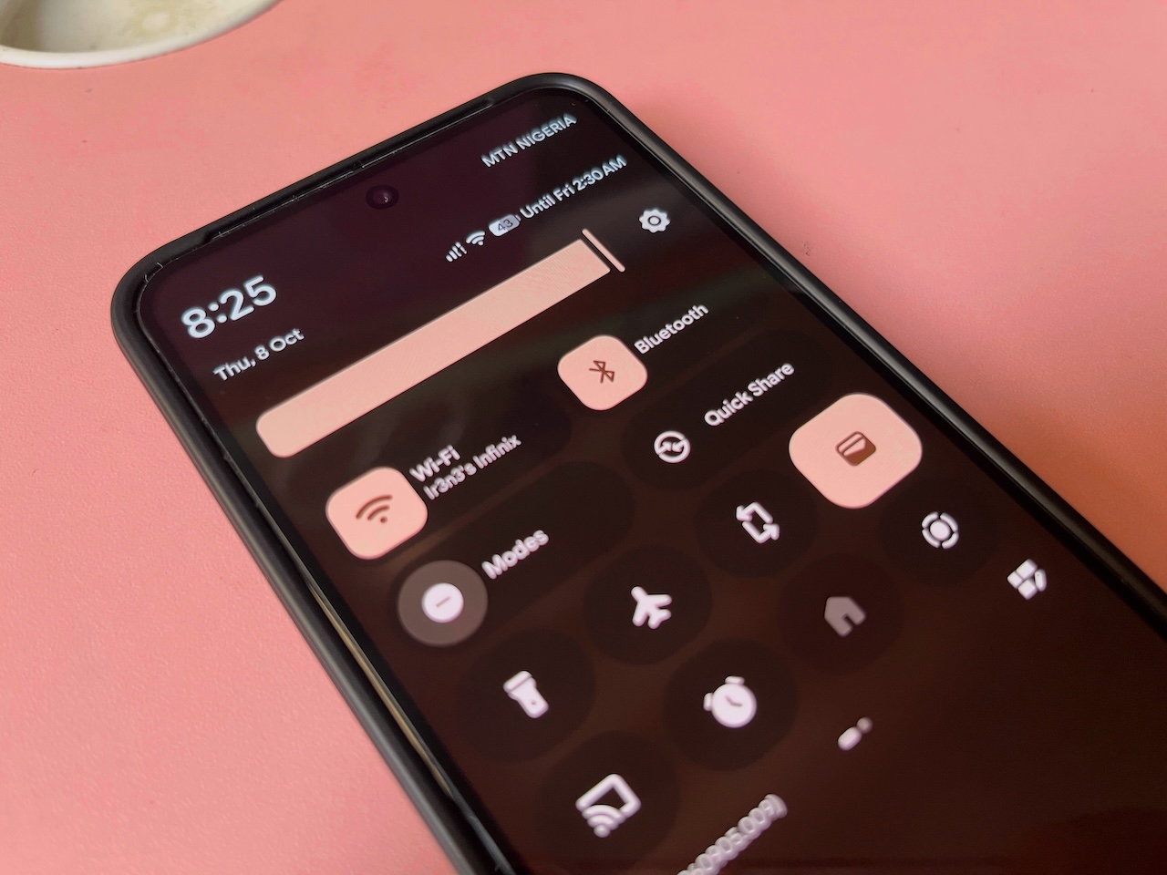 Pixel phone showing Quick Settings panel with Wi-Fi and Bluetooth turned on