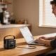 Jackery Explorer 100D powering a laptop on a desk