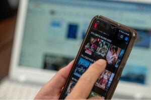 Person browsing Korean TV shows on the Netflix app using an Android smartphone.