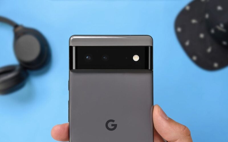 Rear view of a Google Pixel 6 smartphone showing its black camera bar and Google logo.