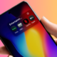 Smartphone showing a folder of streaming apps including Hulu, HBO Max, Netflix and Apple TV