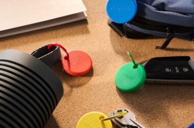Colorful Chipolo Pop Bluetooth trackers on a desk beside keys