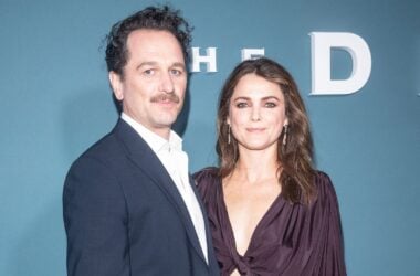 Matthew Rhys and Keri Russell posing together at a red carpet event for The Diplomat.