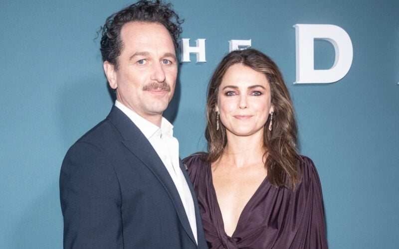 Matthew Rhys and Keri Russell posing together at a red carpet event for The Diplomat.
