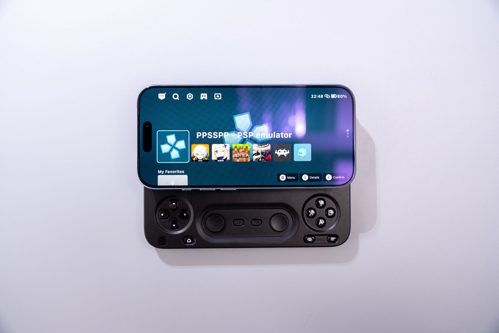 Abxylute M5 controller extended under a phone running a game launcher