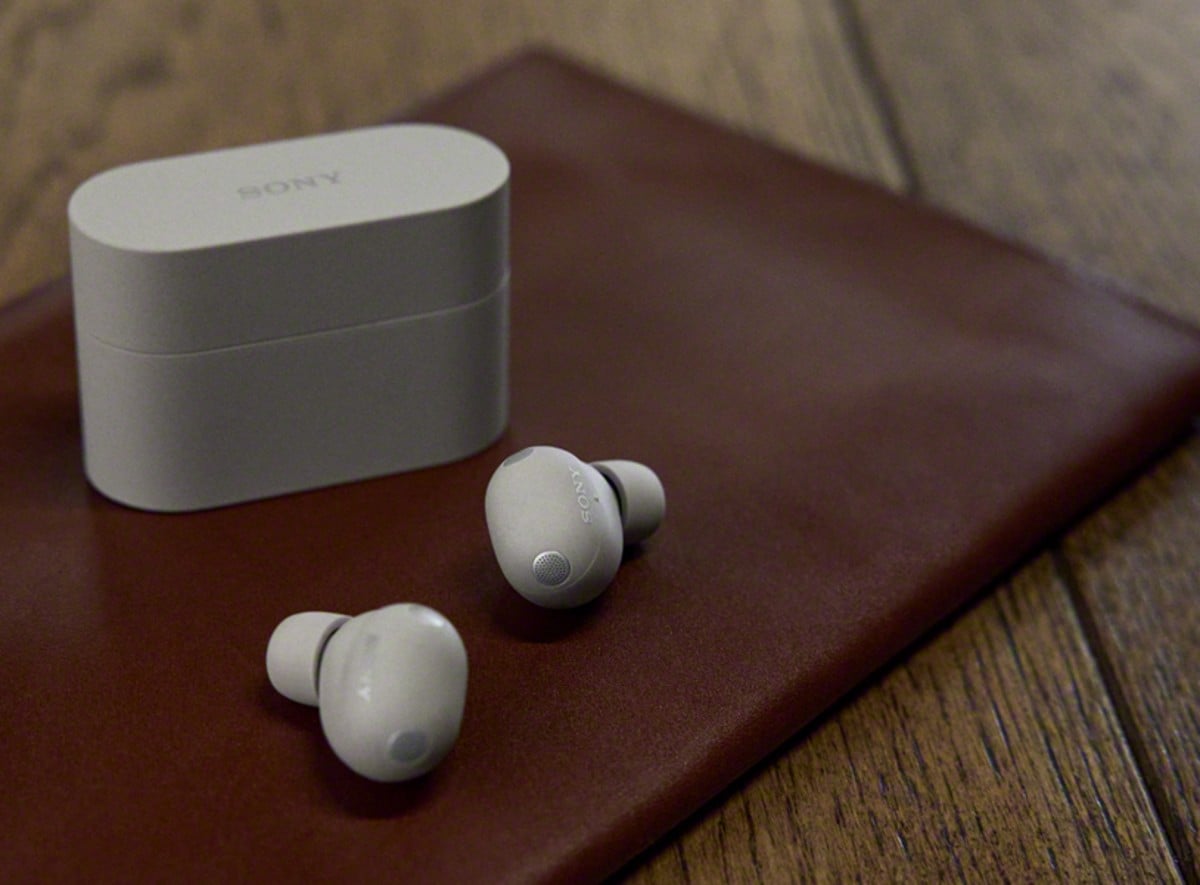 Sony WF-1000XM6 earbuds beside the charging case