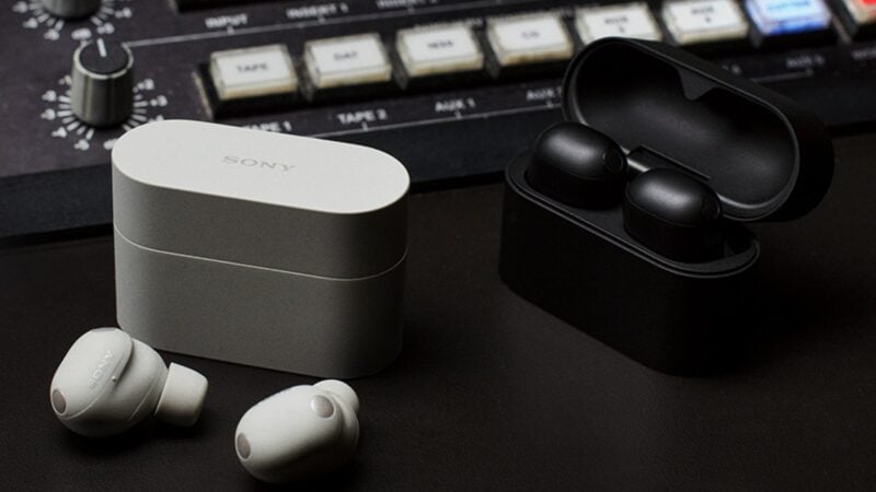 Sony WF-1000XM6 earbuds and charging cases on a studio desk